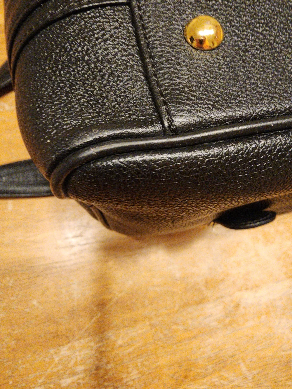 MCM Black Leather Boston Bag featuring polished gold-tone hardware